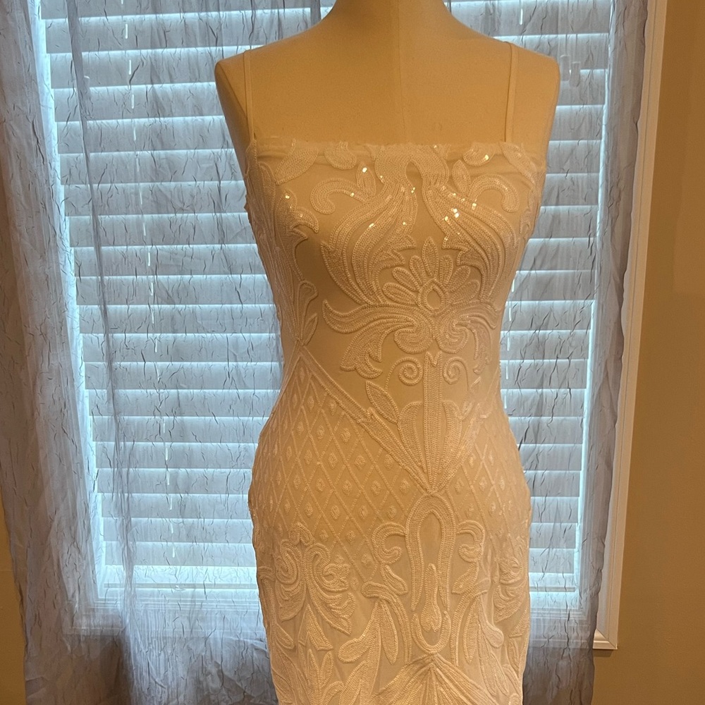 Lulu midi white sequin dress with spaghetti straps.